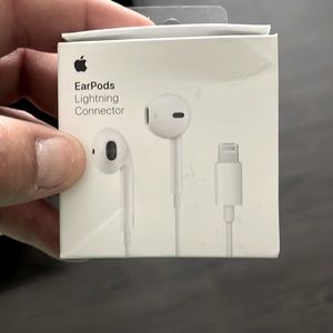 White apple earbuds lighting connector